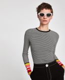 Knit Sweater with a Round Neckline Contrasting Ribbed Trims.